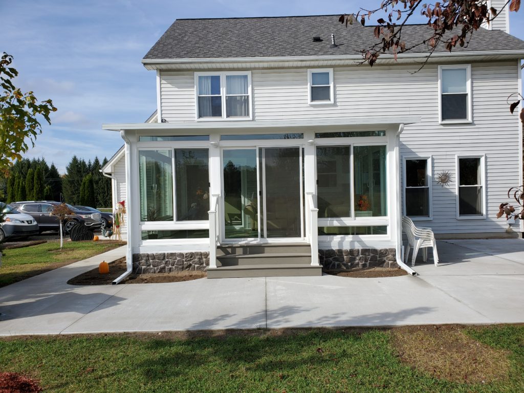 Faux Brick Skirting on this 4 Season Studio Sunroom in Almont - Mr ...